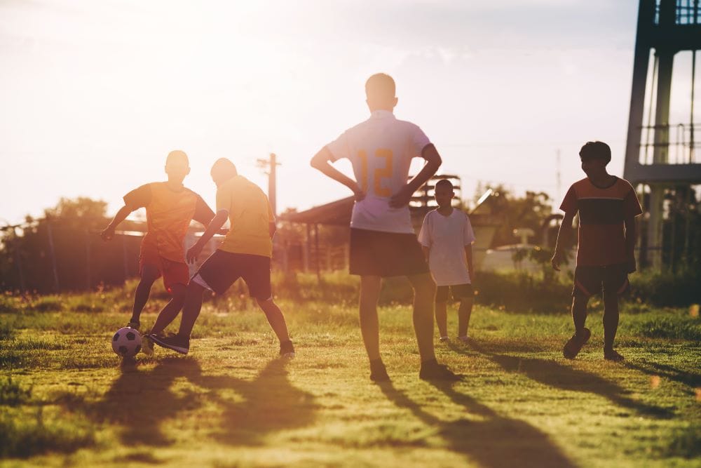 A group of children playing football in Thailand