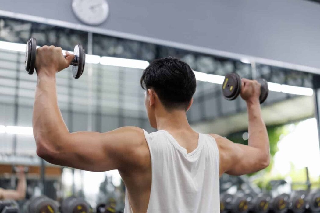 An athlete using dumbbells for strength training and conditioning
