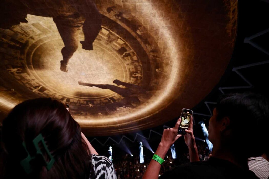 fans at Rajadamnern Stadium watch a video on the dome ceiling display