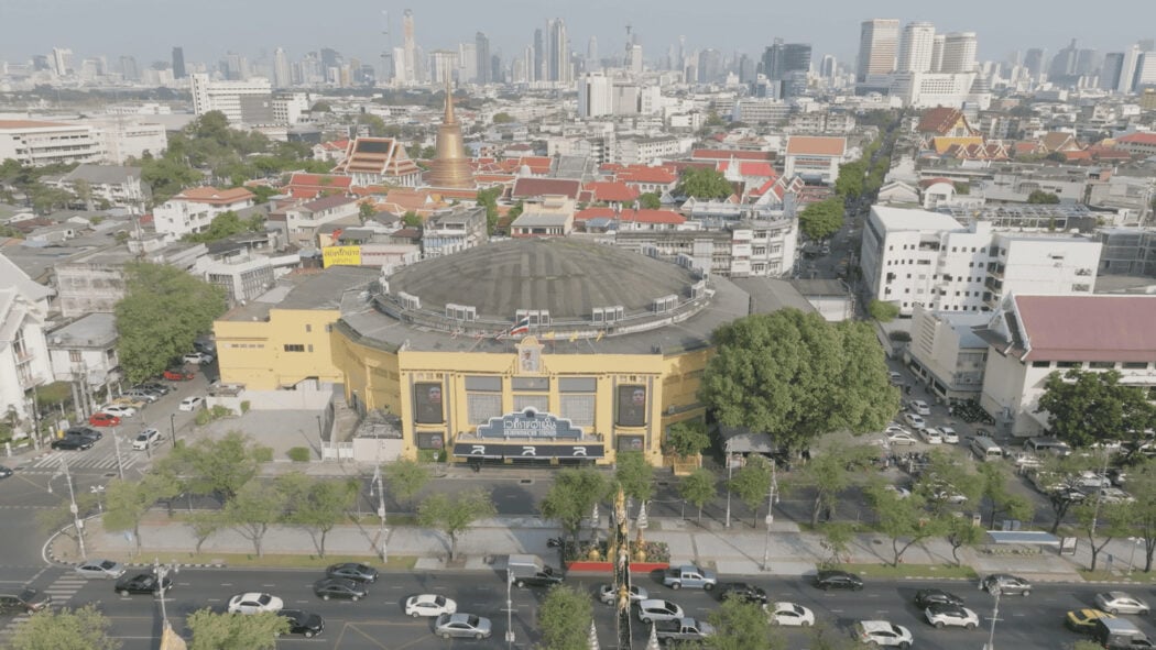 Drone shot of old town Bangkok with Rajadamnern Stadium in the foreground